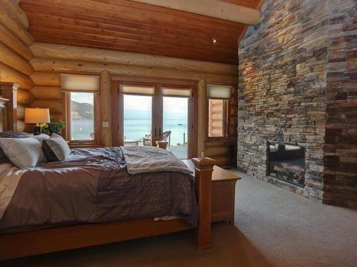 351 Lakeshore Drive, Chase, BC - Indoor Photo Showing Bedroom With Fireplace