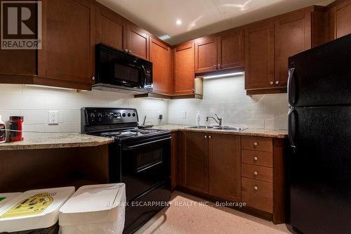 #413 -66 Bay St S, Hamilton, ON - Indoor Photo Showing Kitchen With Double Sink