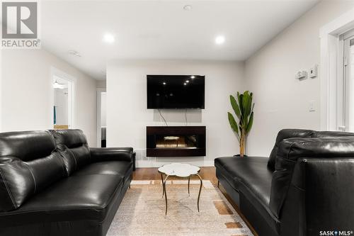 303 1863 Rae Street, Regina, SK - Indoor Photo Showing Living Room With Fireplace