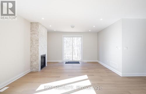 8 Alexander Street, Springwater, ON - Indoor With Fireplace