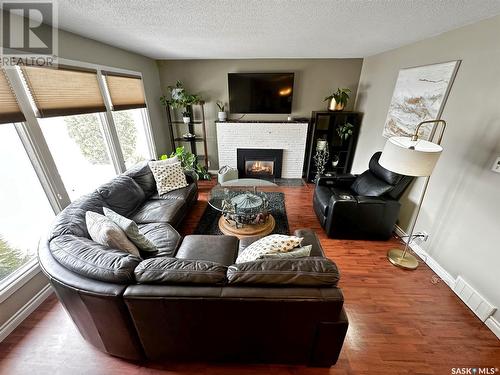 582 5Th Avenue Nw, Swift Current, SK - Indoor Photo Showing Living Room With Fireplace