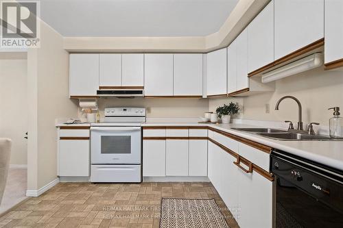 404 - 1 Queen Street, Cobourg, ON - Indoor Photo Showing Kitchen With Double Sink