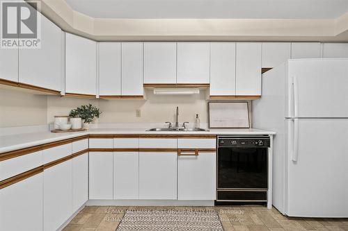 404 - 1 Queen Street, Cobourg, ON - Indoor Photo Showing Kitchen With Double Sink