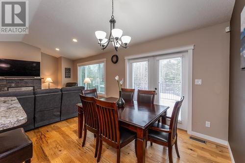 5433 Chief Lake Road, Prince George, BC - Indoor Photo Showing Dining Room With Fireplace