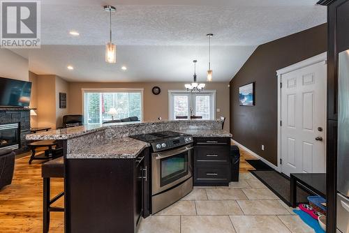 5433 Chief Lake Road, Prince George, BC - Indoor Photo Showing Kitchen With Fireplace