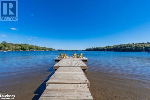 Docks on beach - 1869 Muskoka Road Hwy 118 W Unit# Btv-E106, Bracebridge, ON - Outdoor With Body Of Water With View