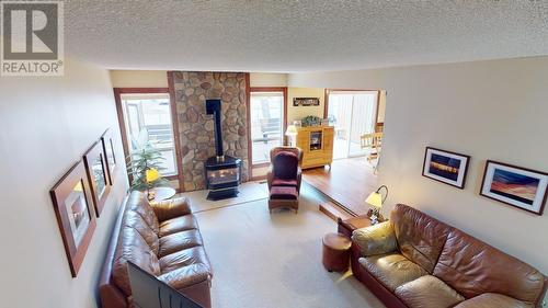10626 102 Street, Fort St. John, BC - Indoor Photo Showing Living Room With Fireplace