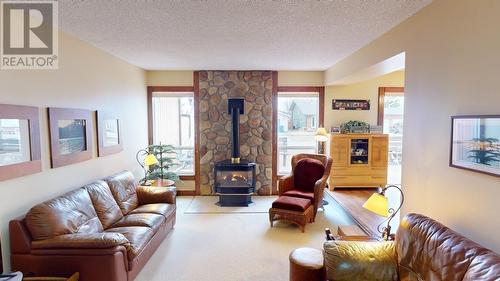 10626 102 Street, Fort St. John, BC - Indoor Photo Showing Living Room With Fireplace