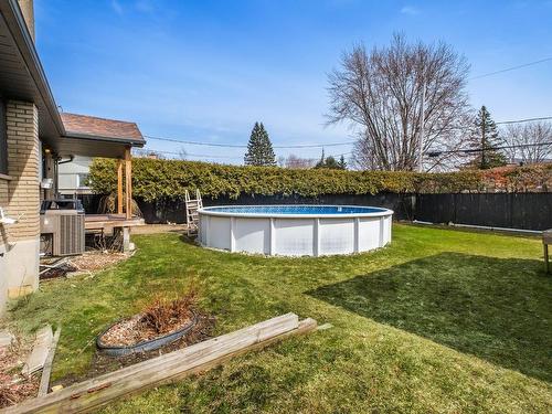 Backyard - 313 Rue Dupré, Beloeil, QC - Outdoor With Above Ground Pool With Backyard