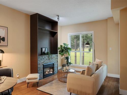 405-1400 Lynburne Pl, Langford, BC - Indoor Photo Showing Living Room With Fireplace