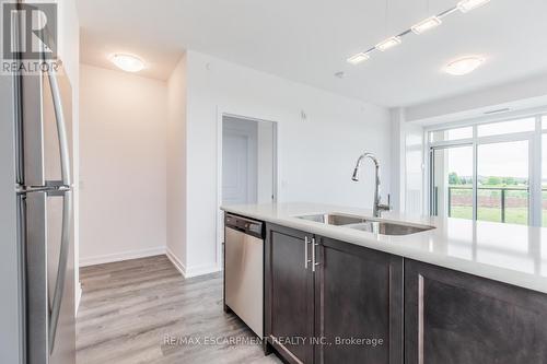 #206 -5055 Greenlane Rd, Lincoln, ON - Indoor Photo Showing Kitchen With Stainless Steel Kitchen With Double Sink With Upgraded Kitchen
