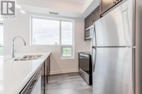 #206 -5055 Greenlane Rd, Lincoln, ON - Indoor Photo Showing Kitchen With Stainless Steel Kitchen With Double Sink