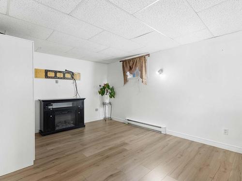 Family room - 157 Rue Deguire, Repentigny (Le Gardeur), QC - Indoor With Fireplace