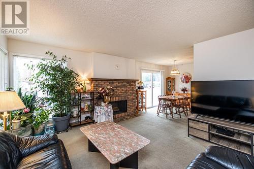 3617 James Drive, Prince George, BC - Indoor Photo Showing Living Room With Fireplace