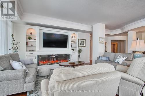 #1104 -33 Ellen St, Barrie, ON - Indoor Photo Showing Living Room With Fireplace