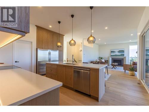 2321 Okanagan Avenue Ne, Salmon Arm, BC - Indoor Photo Showing Kitchen With Fireplace