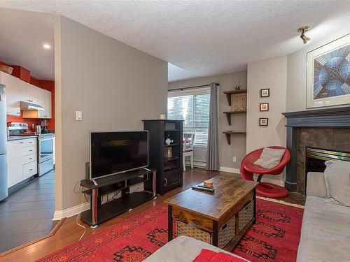 203-7843 East Saanich Rd, Central Saanich, BC - Indoor Photo Showing Living Room With Fireplace