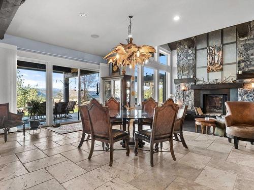 5500 Rockface Road, Kelowna, BC - Indoor Photo Showing Dining Room With Fireplace