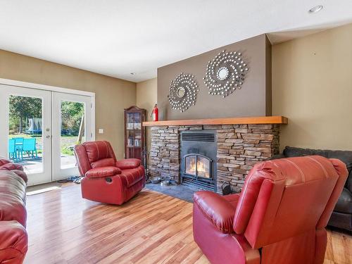 1026 Englishman River Rd, Errington, BC - Indoor Photo Showing Living Room With Fireplace
