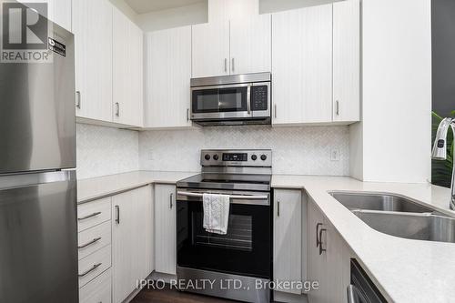 #627 -1105 Leger Way, Milton, ON - Indoor Photo Showing Kitchen With Stainless Steel Kitchen With Double Sink