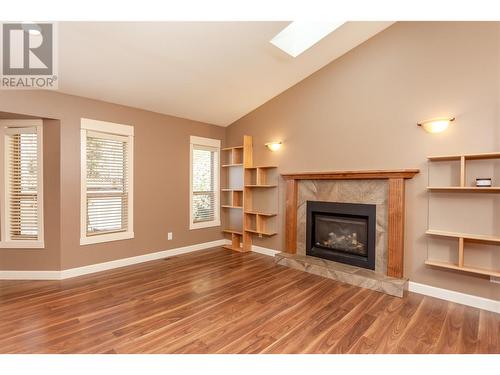 2174 Norris Avenue, Lumby, BC - Indoor Photo Showing Living Room With Fireplace