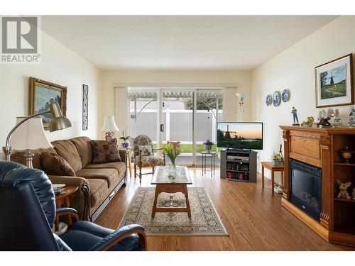 3900 27 Street Unit# 107, Vernon, BC - Indoor Photo Showing Living Room With Fireplace