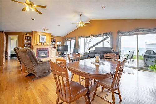 2948 North Shore Drive, Lowbanks, ON - Indoor Photo Showing Dining Room With Fireplace