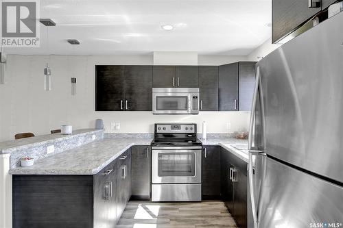 5569 Cederholm Avenue, Regina, SK - Indoor Photo Showing Kitchen With Stainless Steel Kitchen With Upgraded Kitchen