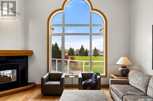 18 Porter Bay, Emerald Park, SK - Indoor Photo Showing Living Room With Fireplace