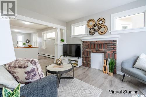 2023 Broder Street, Regina, SK - Indoor Photo Showing Living Room With Fireplace