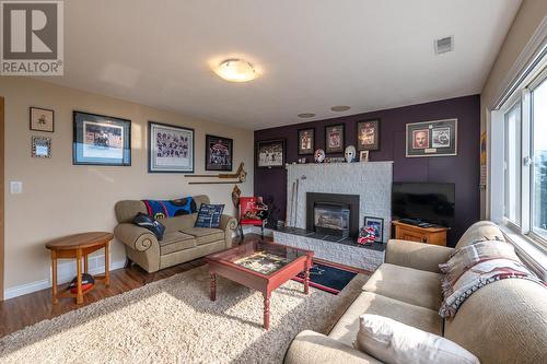 3218 West Bench Drive, Penticton, BC - Indoor Photo Showing Living Room With Fireplace