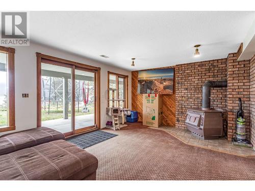 12874 Carrs Landing Road, Lake Country, BC - Indoor With Fireplace