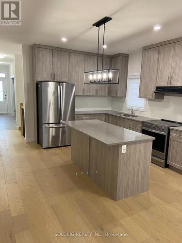 124 Doan Drive, Middlesex Centre, ON - Indoor Photo Showing Kitchen With Double Sink