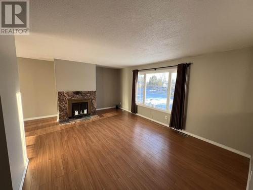 5320 Tamarack Crescent, Fort Nelson, BC - Indoor Photo Showing Other Room With Fireplace