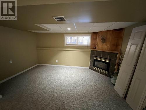 5320 Tamarack Crescent, Fort Nelson, BC - Indoor Photo Showing Basement With Fireplace