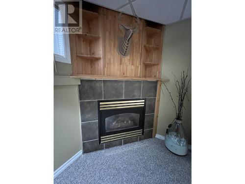 5320 Tamarack Crescent, Fort Nelson, BC - Indoor Photo Showing Living Room With Fireplace