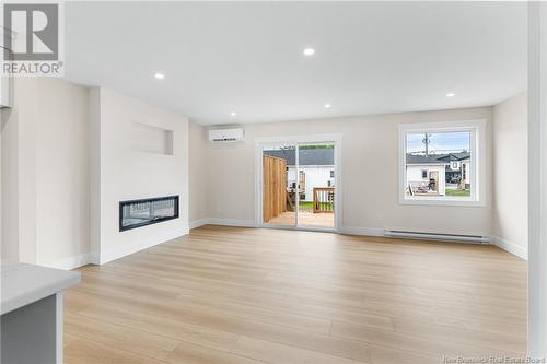 136 Ernest Street, Dieppe, NB - Indoor Photo Showing Living Room With Fireplace