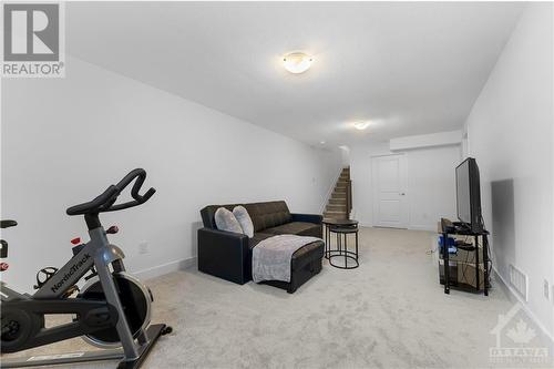Large lower level family room - 637 Rathburn Lane, Ottawa, ON - Indoor Photo Showing Gym Room