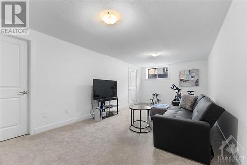 Lower level family room with large window - lots of storage on this level - 637 Rathburn Lane, Ottawa, ON - Indoor