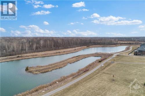 Weather you are a jogger or just like to walk in nature.. this recreation park is the perfect place to "breathe" and of course get your steps in.  Very tranquil. - 637 Rathburn Lane, Ottawa, ON - Outdoor With Body Of Water With View