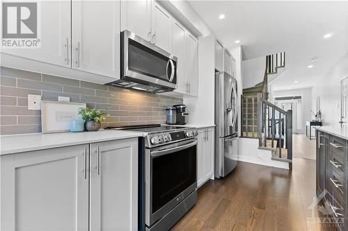 Spacious modern kitchen in open concept main floor.  Extra large foyer and lots of natural light filling this home. - 637 Rathburn Lane, Ottawa, ON - Indoor Photo Showing Kitchen With Upgraded Kitchen