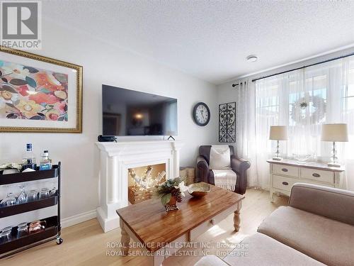 #405 -243 Ruttan Terr, Cobourg, ON - Indoor Photo Showing Living Room With Fireplace
