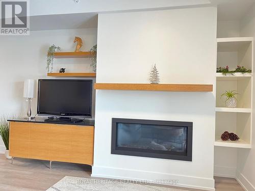#402 -19B West Street North, Kawartha Lakes, ON - Indoor With Fireplace