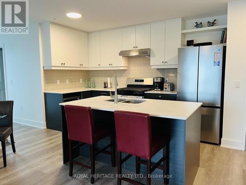 #402 -19B West Street North, Kawartha Lakes, ON - Indoor Photo Showing Kitchen With Double Sink