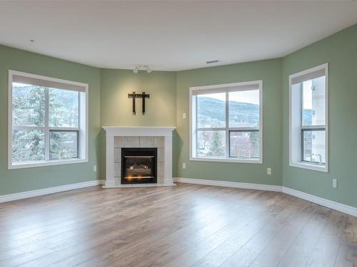406-2245 Atkinson Street, Penticton, BC - Indoor Photo Showing Living Room With Fireplace