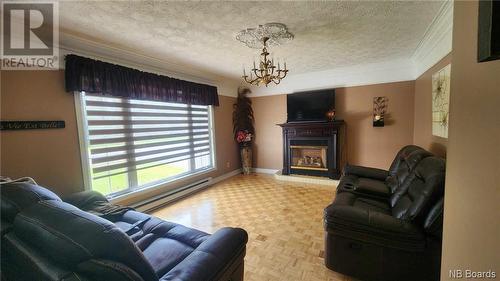 468 Rue Acadie, Beresford, NB - Indoor Photo Showing Living Room With Fireplace
