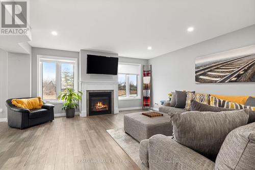 87 Keeler Crt, Asphodel-Norwood, ON - Indoor Photo Showing Living Room With Fireplace