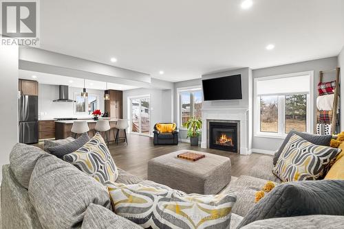 87 Keeler Crt, Asphodel-Norwood, ON - Indoor Photo Showing Living Room With Fireplace