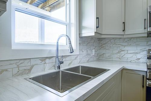 1607 1St Avenue S, Cranbrook, BC - Indoor Photo Showing Kitchen With Double Sink