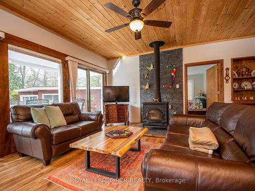 7 Normwood Cres, Kawartha Lakes, ON - Indoor Photo Showing Living Room With Fireplace